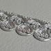 Picture of Agremano Braided Trim silver metal Fleur-de-lis H. cm 1,2 (0,47 inch) Metallic thread and Viscose Border Edge Trimming for liturgical Vestments